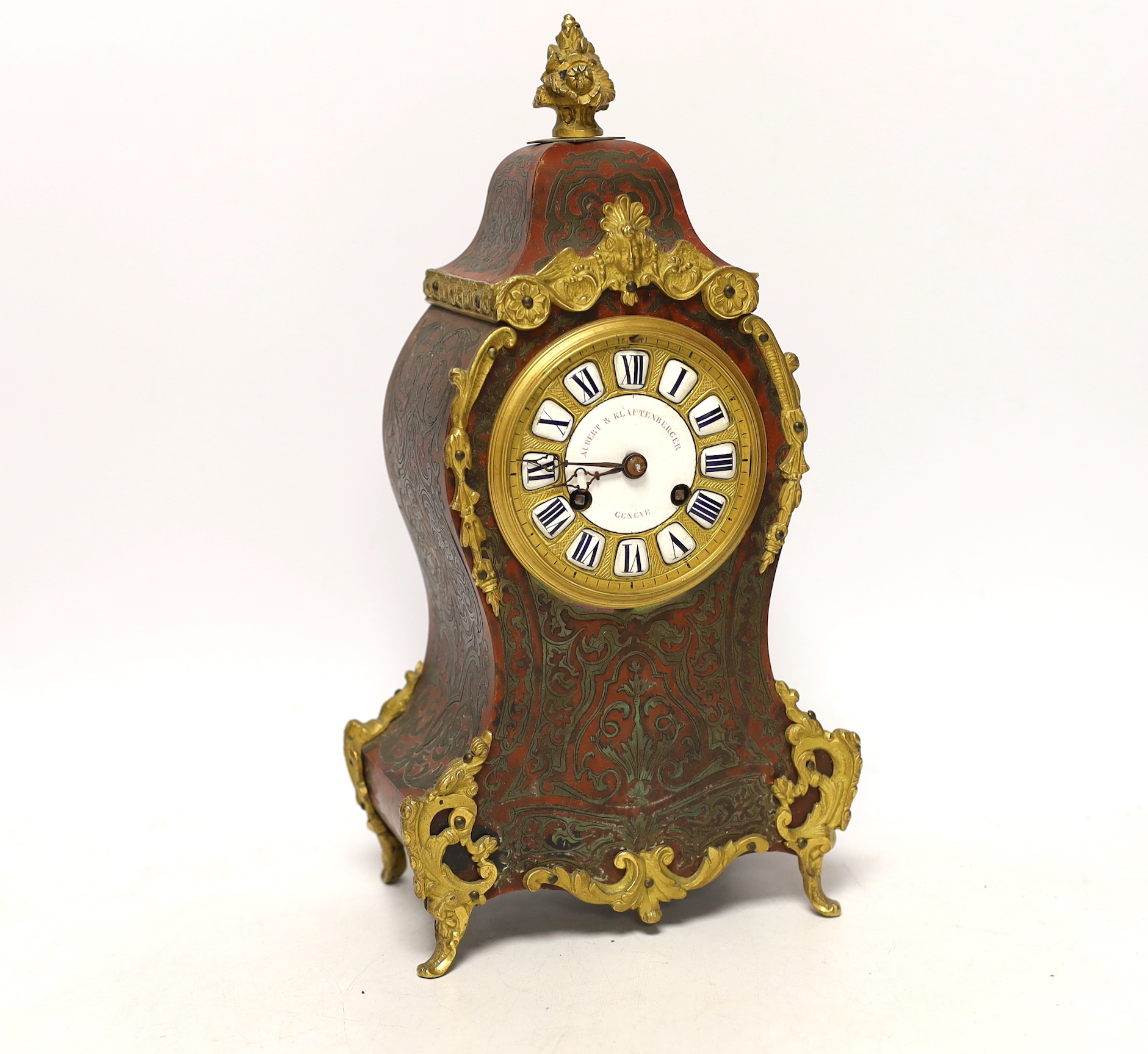 A late 19th century red boulle work tortoiseshell mantel clock, white enamel dial and numerals, Aubert Klaftenberger Geneva, with keys and pendulum, 30cm
